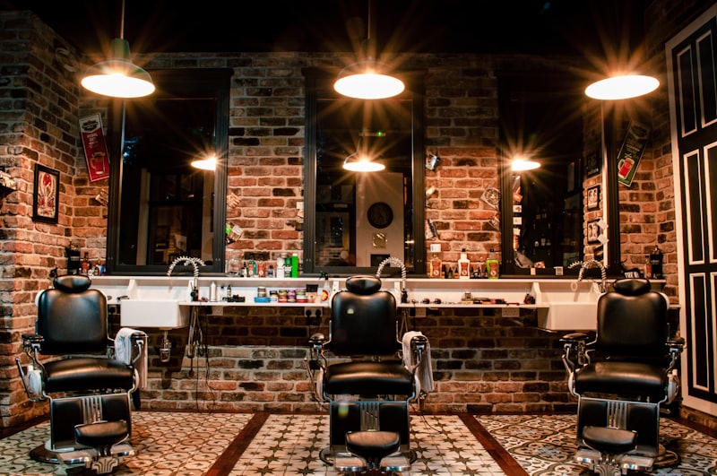 Barber chair against brick wall